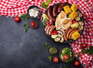Grilled sausages, meat, and vegetables.