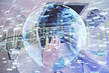 Multi exposure of businessman working on laptop on background. International business hologram in front. Concept of success.