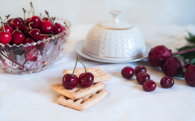 Beautiful two petioles on a sand cookie. Fruit and cookies to the beautiful summer breakfast.