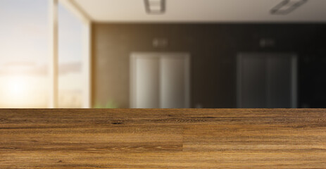 blurred interior on a wooden table background.lobby with a large window. Reception in the business center. elevator doors. decorative dark walls.. 3D rendering. Sunset