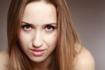 Emotional girl portrait on the brown background