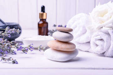Obraz na płótnie Canvas Spa massage set with lavender oil on wooden background