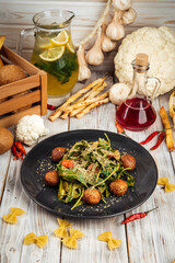Salad with greens falafel cucumber cherry tomato