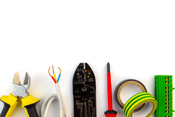 Electrician tools laid out in a flat lay on a white background with copy space for text.
