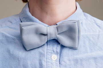 Blue bow tie on a woman's neck