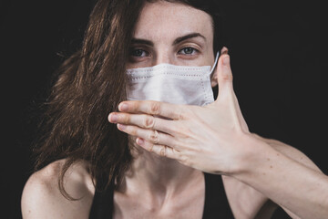 young model posing with coronavirus mask