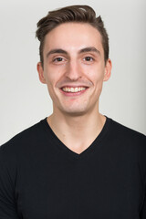 Fototapeta premium Face of happy young handsome man smiling