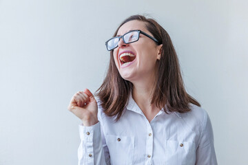 Beautiful happy girl smiling. Beauty simple portrait young smiling brunette woman in eyeglasses isolated on white background. Positive human emotion facial expression body language. Copy space