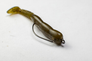 silicone fishing lure on an offset hook isolated on a white background