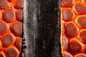 Extreme macro photo of a basketball. Sports background.