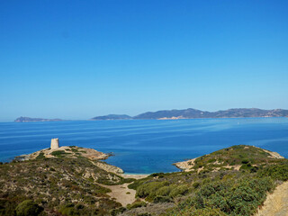 Fototapeta na wymiar Sardinia View of the sea in front of Porto Budello, Teulada, in the background a watchtower