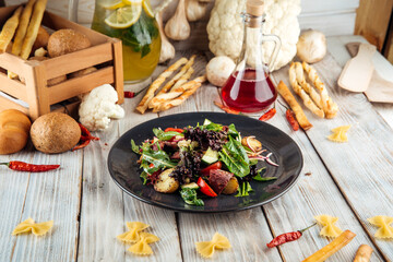 Warm salad with horsemeat pastrami baby potatoes