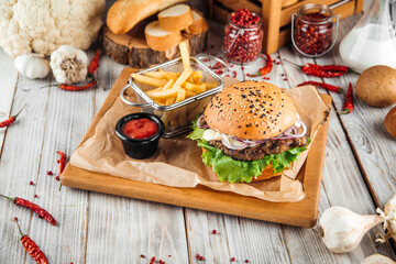 Delicious burger with lamb cutlet and vegetables