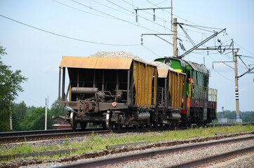 Fototapeta na wymiar long-distance train with wagons for transportation of goods over long distances