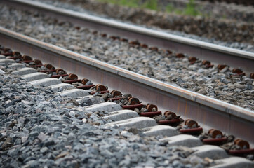 Obraz premium Steel and concrete railway track shallow depth of field