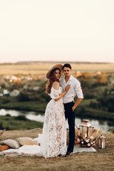 Beautiful wedding couple in nature in boho style. Wedding in the European style of fineart at...
