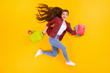 Top view above high angle flat lay flatlay lie concept of nice cheerful cheery glad girl nerd running hurry rush late lesson autumn fall isolated on bright vivid shine vibrant yellow color background