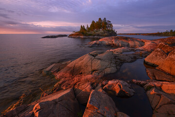 Rocky shore of the orthern lake at dawn, lake Ladoga