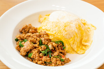 stir-fried pork and basil with creamy omelet on rice