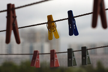 ropes with clothespins on the balcony of a city house