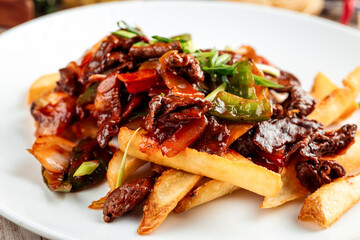 Gourmet cafe dish stewed beef with potato fries