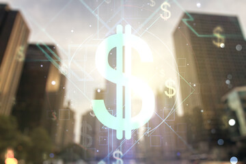 Double exposure of virtual USD symbols hologram on modern skyscrapers background. Banking and investing concept