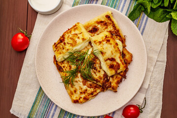 Hot appetizer - pita bread with cheese and herbs. Vegetarian healthy food