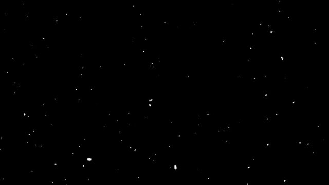 snow falling on black background