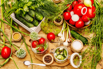Pickling vegetables concept. Cooking process, spices, fresh fragrant herbs