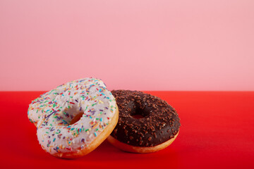 two donuts on colored background stock photo