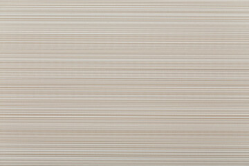 Obraz premium Base texture with embossed horizontal lines beige grey. Background design with space for text.