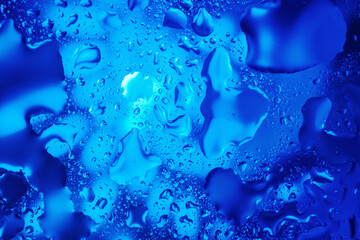 Water drops on a blue abstract background