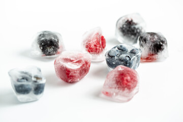 ice cube with raspberry and blueberry