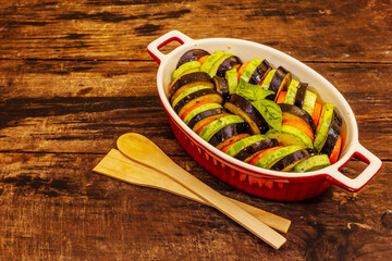 Fresh vegetables for baking. Eggplant, zucchini, carrots, spices and basil