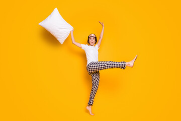 Full length body size view of her she nice attractive lovely funky comic childish cheerful cheery girl jumping having fun isolated on bright vivid shine vibrant yellow color background