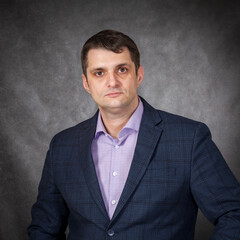 a young man businessman on a plain background.