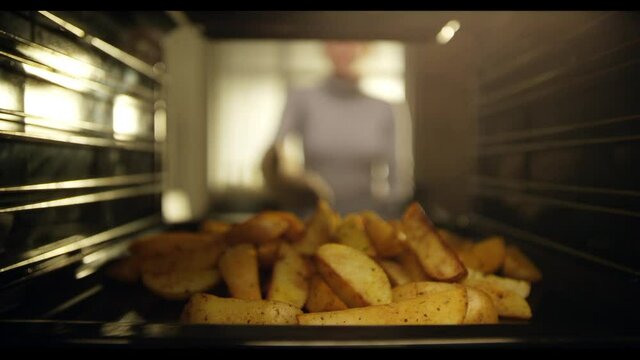 4K Thanksgiving Turkey Cooking In Oven. Preparing tipical delicious potato food