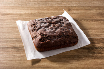 Sweet chocolate sponge cake on wooden table