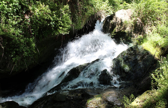 Small waterfall on the mountain. A waterfall near the town of Los Fayos (Zaragoza, Spain), called "Cascada de las Truchas" (waterfall of the trout)