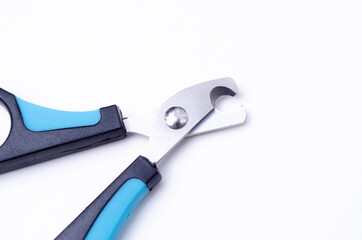 Cat claw scissors for cats with black and blue handle on a white background in macro