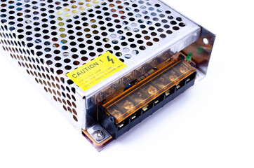 Power supply for LED strip on a white and black background in macro. 240v to 12v converter