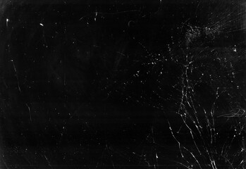 Dirty broken glass. Smashed screen texture. Black weathered tablet display with white dust...
