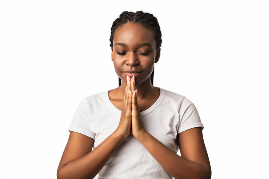 Black Woman Praying Holding Hands In Prayer Gesture, White Background