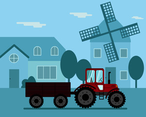 A tractor with a trailer rides along a village street with a mill.
