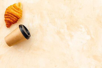 Coffee and croissants on stone table top view