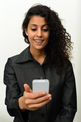 Portrait of happy young beautiful Hispanic businesswoman