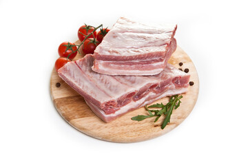 raw ribs on a cutting board isolated on a white background