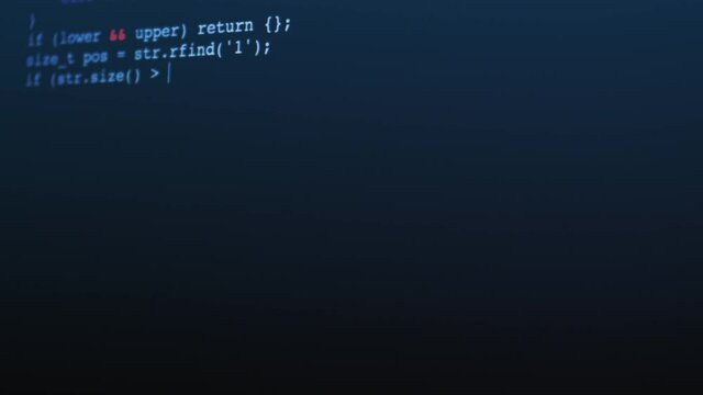 Programmer coding on computer screen of an engineer developing software app.