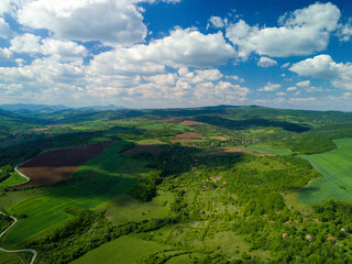 landscape with hills and blue sky from drone