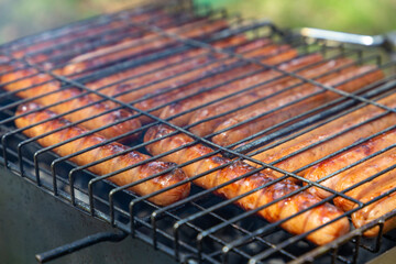 barbecue grill sausages close up. Dinner on the nature.